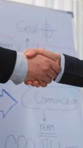 Business handshake symbolizing trust and collaboration in a YouTube Short.