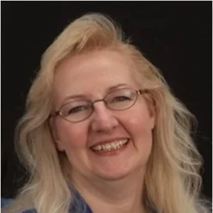 Smiling instructional designer testimonial image endorsing Nightwatch rapid eLearning service