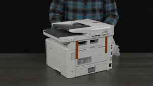 Unboxing the HP LaserJet Pro printer during the setup tutorial video production